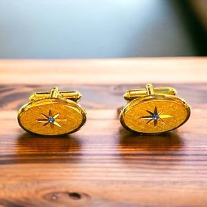 Avon gold tone vintage cuff links with simulated sapphire
